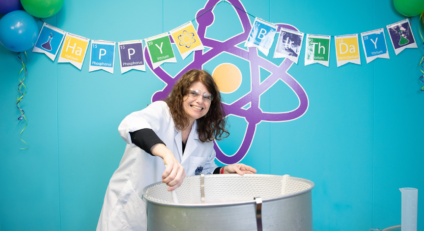 Instructor at a birthday party making cotton candy.