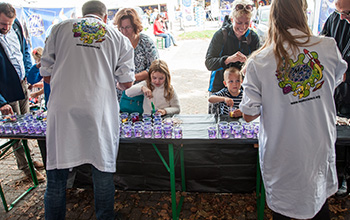 Kids at a booth playing with slime 